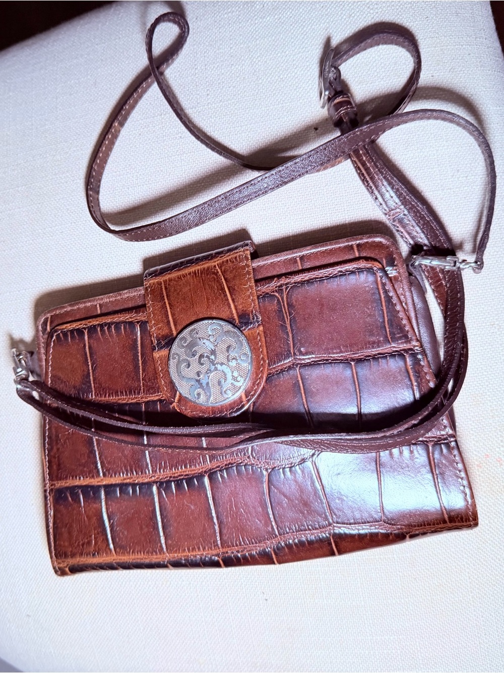 Brighton Brown Croc-Embossed Crossbody Wallet with Decorative Medallion